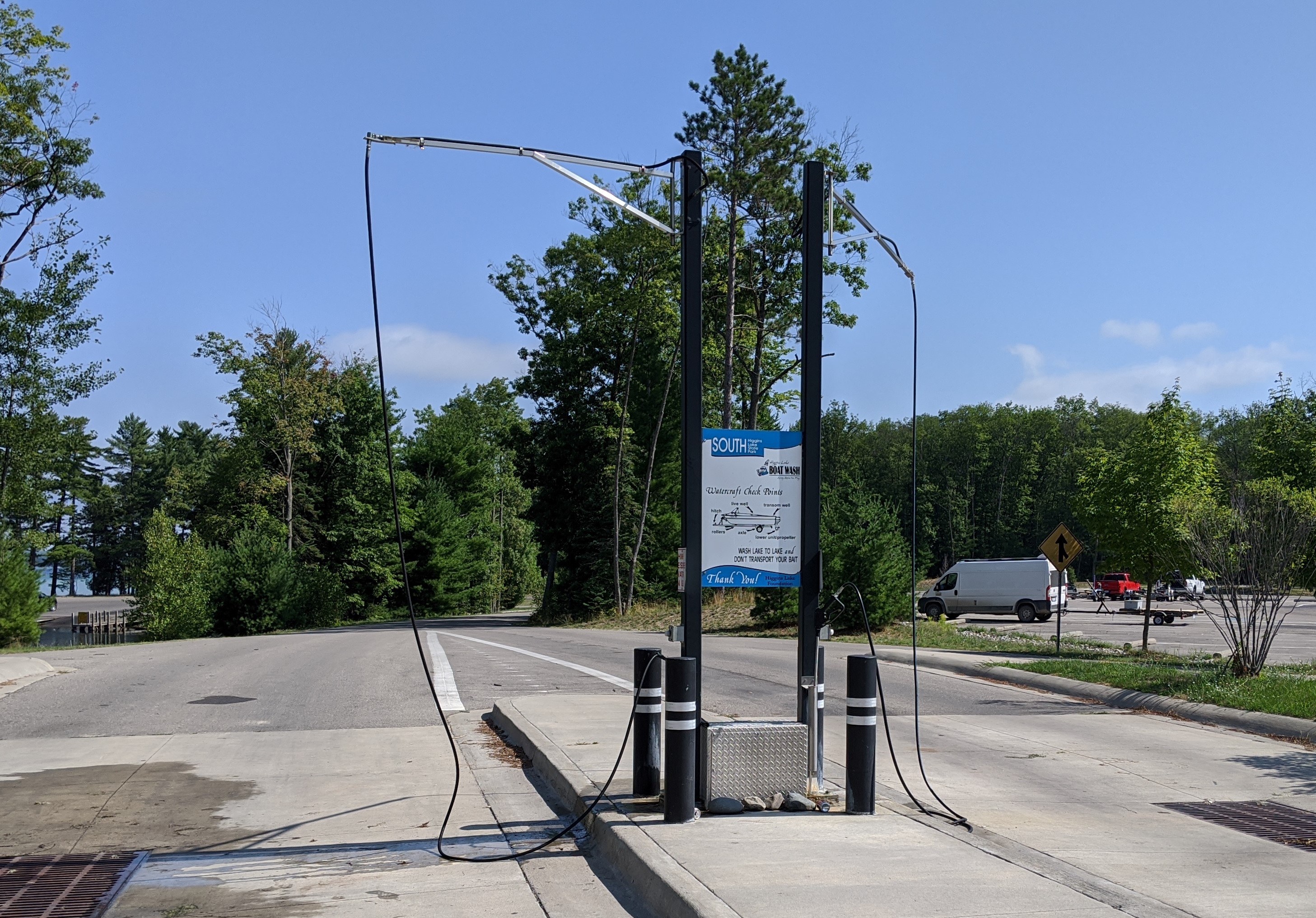 Permanent boat cleaning system standing in parking lot.